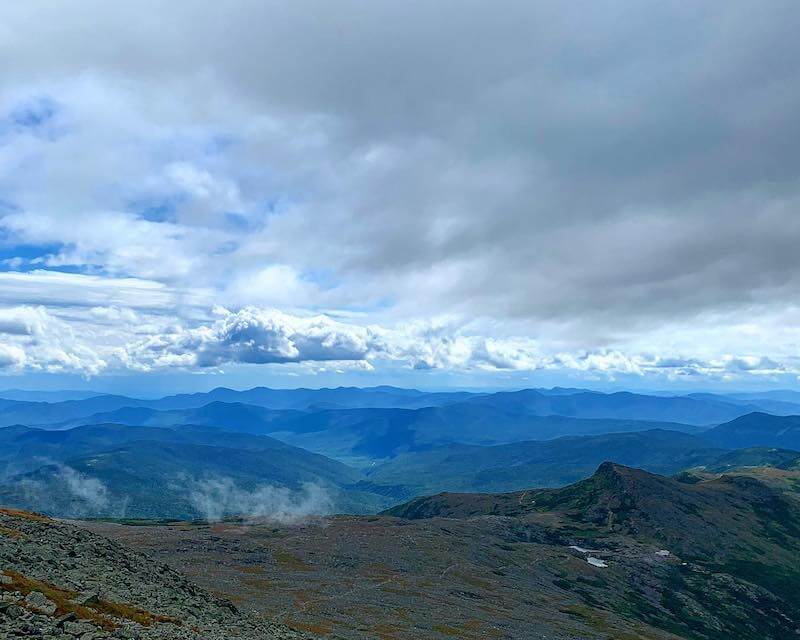 View of Mountains and clouds as seen from top of Mount Washington